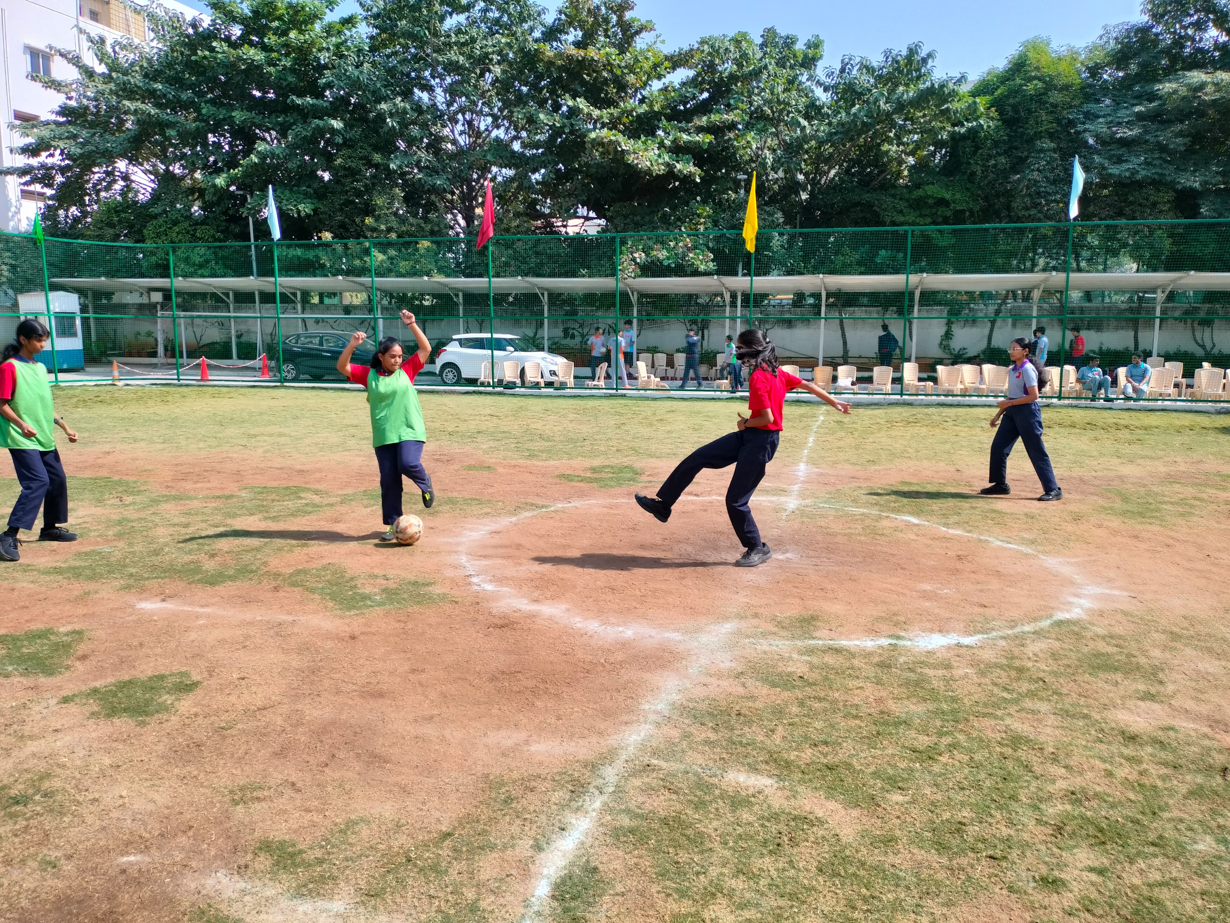  Meru International School students engaged in a football game.