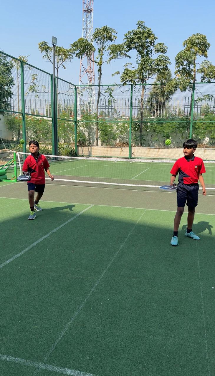  Meru students mastering every shot on the pickleball court.