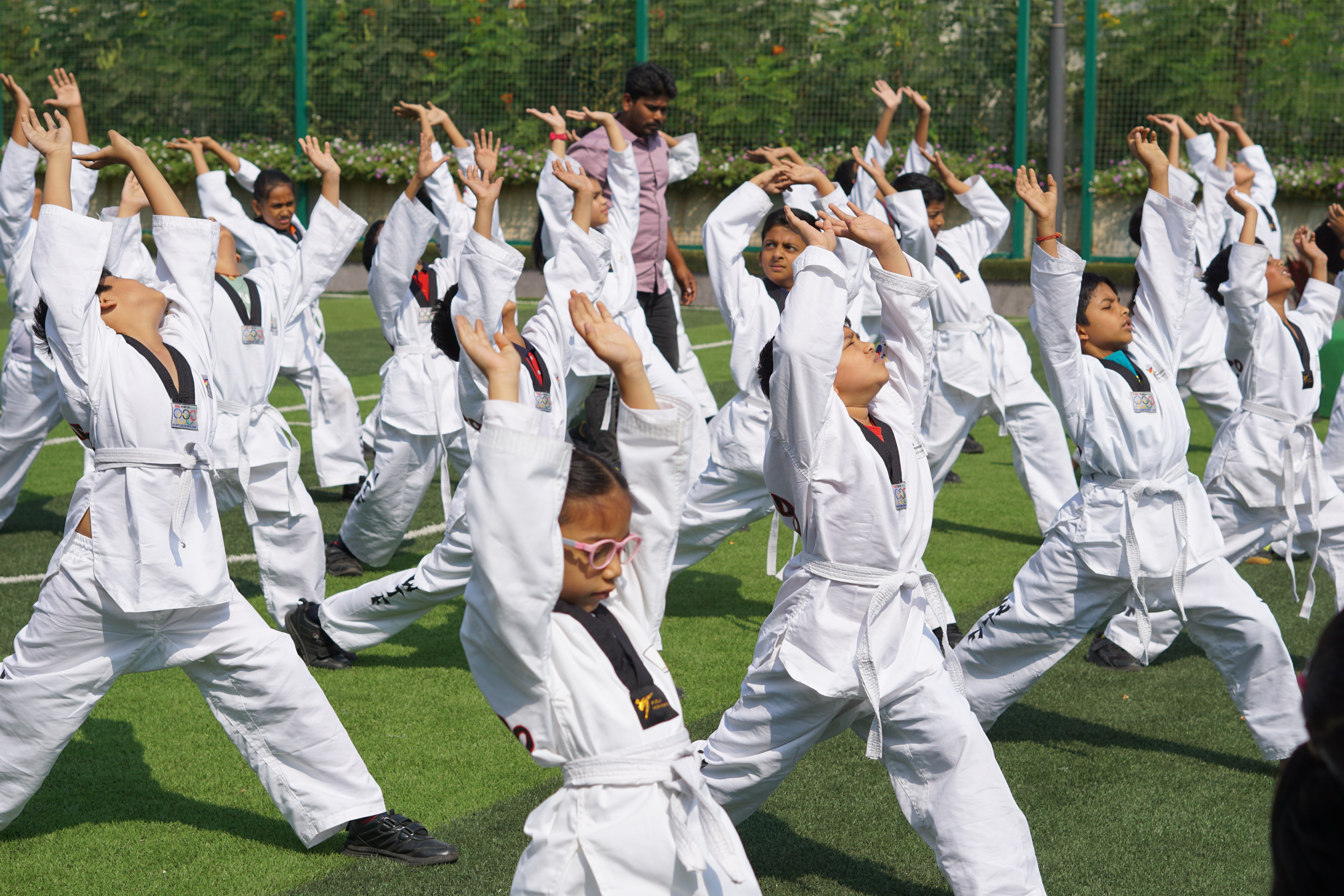 Students at Meru International School practicing taekwondo with focus and precision