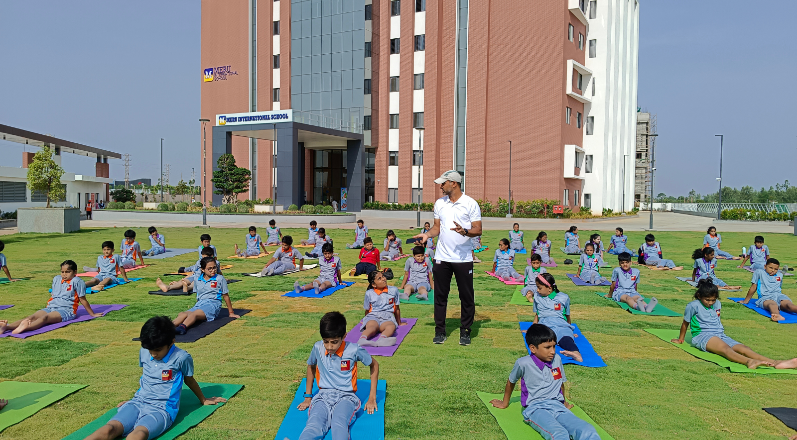  Students at Meru International School practicing mindfulness through yoga poses